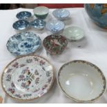 An 18th/19th century Chinese "Famille Rose" armorial dish; various modern Chinese rice bowls; etc.