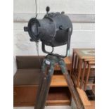 A 1950's theatre spotlight on substantial adjustable tripod