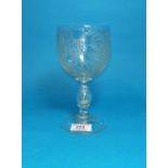 A mid Victorian engraved glass goblet, multi-knop stem with bubble containing a silver 3d, dated