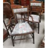 A pair of Edwardian inlaid spindle back dining chairs