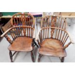 A 19th century near pair of Windsor chairs with low backs and crinoline stretcher