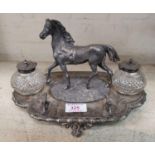 A Victorian silver plated standish in the form of a horse, with twin cut inkwells, on shaped