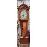 A 19th century longcase clock, the arch top hood with turned pillars and brass finials, quarter