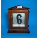 A late 19th century American chiming mantel clock in oak case; a wooden pen stand/calendar; a