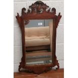 A large bevelled edge wall mirror