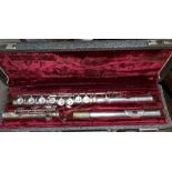 A cased 3 sectional silver plated flute by Whitehall