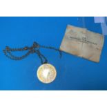 A silver gilt medallion on 9 carat gold chain, 11 gm approx