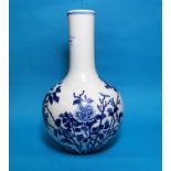 A spherical Chinese vase with tall slender neck in underglaze blue with flowering branches,