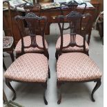 An Edwardian set of 4 mahogany salon chairs with wheatsheaf splats