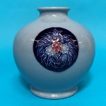 A modern Moorcroft spherical blue vase with circular floral panels signed height 4.5"