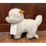 A modern Steiff Whitey West Highland terrier with original ear button and paper label, length 9"