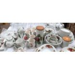 A large selection of Portmeirion "Pomona"; similar dinner and kitchenware, with wall clock, 55
