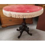 A Victorian walnut occasional table on carved column and quatrefoil legs, velvet re-covered top