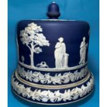 A 19th century large blue jasperware stilton dish and cover decorated with classical figures in