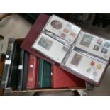 A collection of stamps and first day covers in albums.