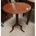 An early 19th century mahogany wine table with circular tilt top, on turned column and triple feet
