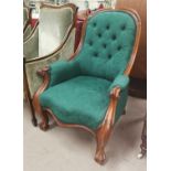 A Victorian lady's rosewood spoonback armchair in green, with knurled arms and feet