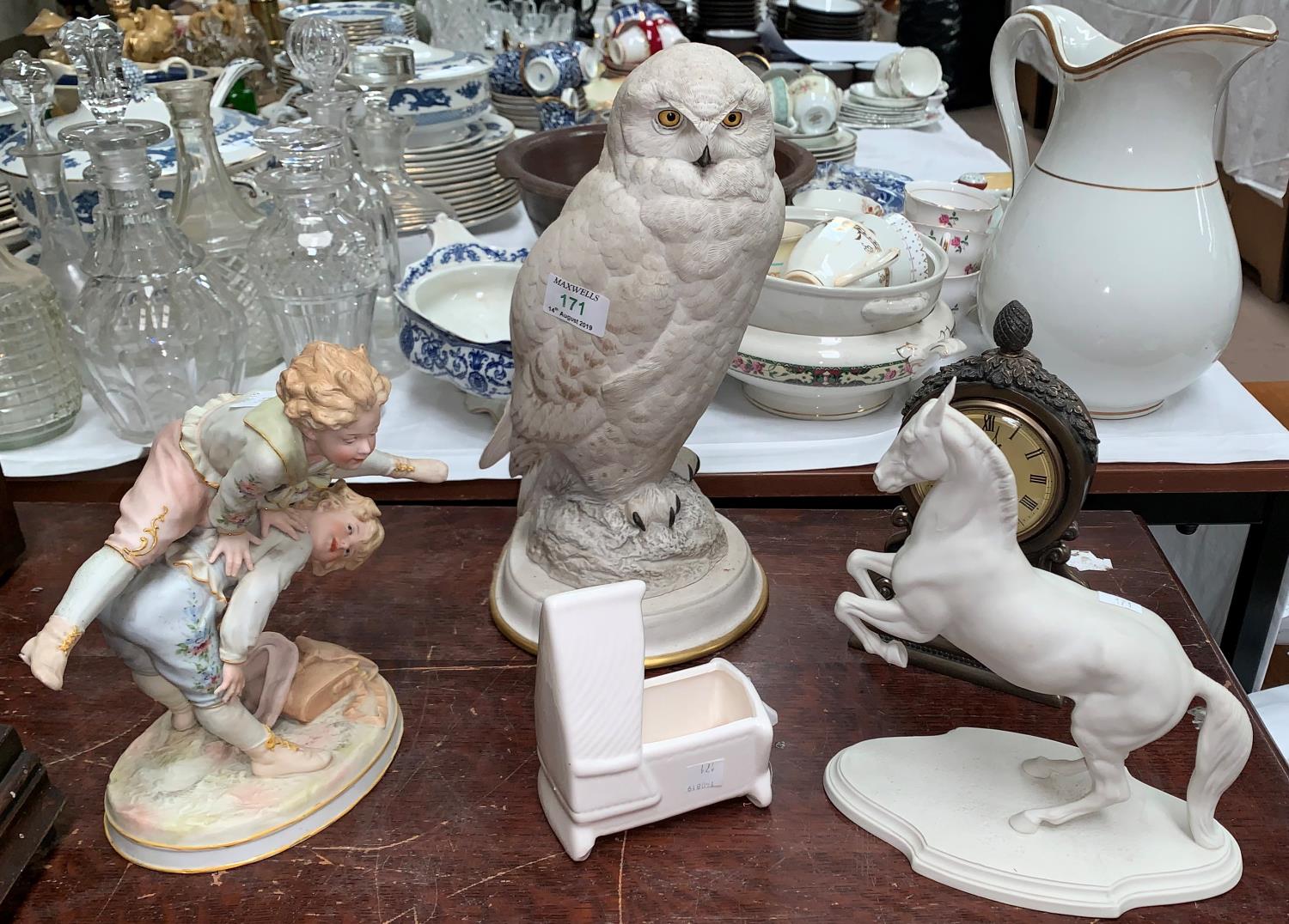 A china Snowy Owl - Raymond watson for the Franklin Mint; a bisque group, 2 boys playing leap frog