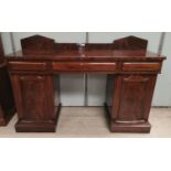 A William IV mahogany sideboard, twin pedestal, low raised back, 3 frieze drawers and 2 pedestal