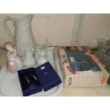 A collection of 6 Portmeirion bisque jugs; a boxed doll's tea set; a Nao figure; a boxed pair of