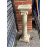 A reconstituted Greek style reeded garden column