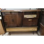 A 1950's Blaupunkt 'Blue Spot' radiogram unit with cocktail section, with mirrored and studded