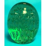 A Victorian green glass 'Dumpy' paperweight of ovoid form with elongated internal bubbles, height 6"