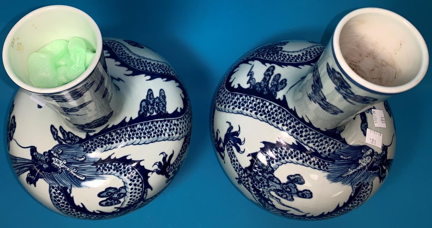 A Chinese pair of globular vases with underglaze blue decoration of dragons, 12" (one with - Image 2 of 4