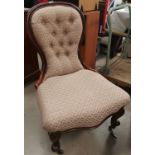 A 19th century mahogany spoon back nursing chair in pink dralon