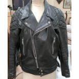 A Vintage 'T.T.Leathers' black leather biker jacket with red quilted lining 107cm 42".