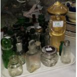 A Murano figure of a Chinese man; a selection of 19th century green glass medicine and other bottles
