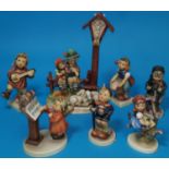 A Hummel figure group "Wayside Devotion" and 6 other Hummel figures