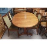 A 1960's G-Plan dining suite comprising extending oval table, and 4 chairs in green dralon