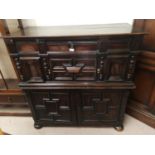 An 18th/19th oak unusual side cabinet in the William & Mary style, the upper section with single