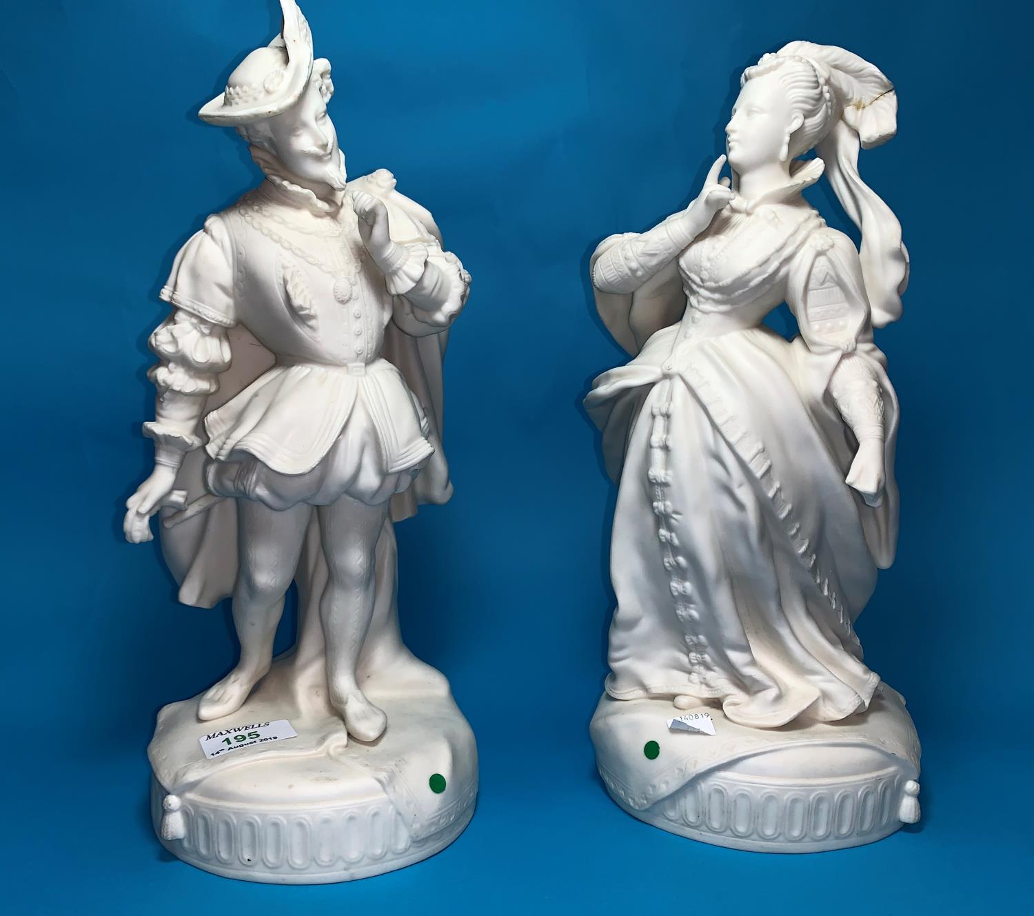 A pair of continental bisque porcelain figures of a courtly lady and gentleman, 35 cm (some damage)