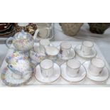 A Foley Art Deco 'Tea for Two' 7 piece tea set; a Royal Worcester set o 6 floral bouquet coffee cans