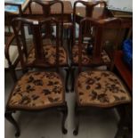 An Edwardian set of 4 inlaid mahogany salon chairs