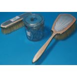 A silver gilt and enamel hairbrush and matching clothes brush; a hairpin tray with silver top