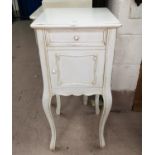 A "French Provincial" bedside cabinet in cream finish; a white towel rail