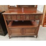 An Edwardian walnut 2 tier buffet with 2 frieze drawers and double cupboard, on ball and claw