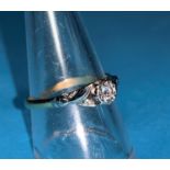 A ladies yellow and white metal dress ring stamped 18ct platinum with central illusion set diamond