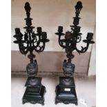 A gilt metal pair of 5 sconce candelabra on black marble bases