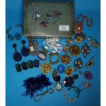 A selection of costume brooches and jewellery etc