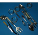 Four silver napkin rings; a toddy ladle (unmarked); items of cutlery