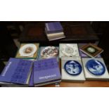 A selection of Royal Copenhagen Christmas plates and others including Wedgwood etc from the 1960's