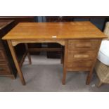 A 1930's oak kneehole desk with single pedestal