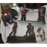 Four cast metal money boxes: "Home Town"; man shouting at a tree; elephant & pig