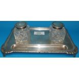 A silver ink stand with two cut glass silver lidded ink pots, (marks on stand rubbed) lids marked