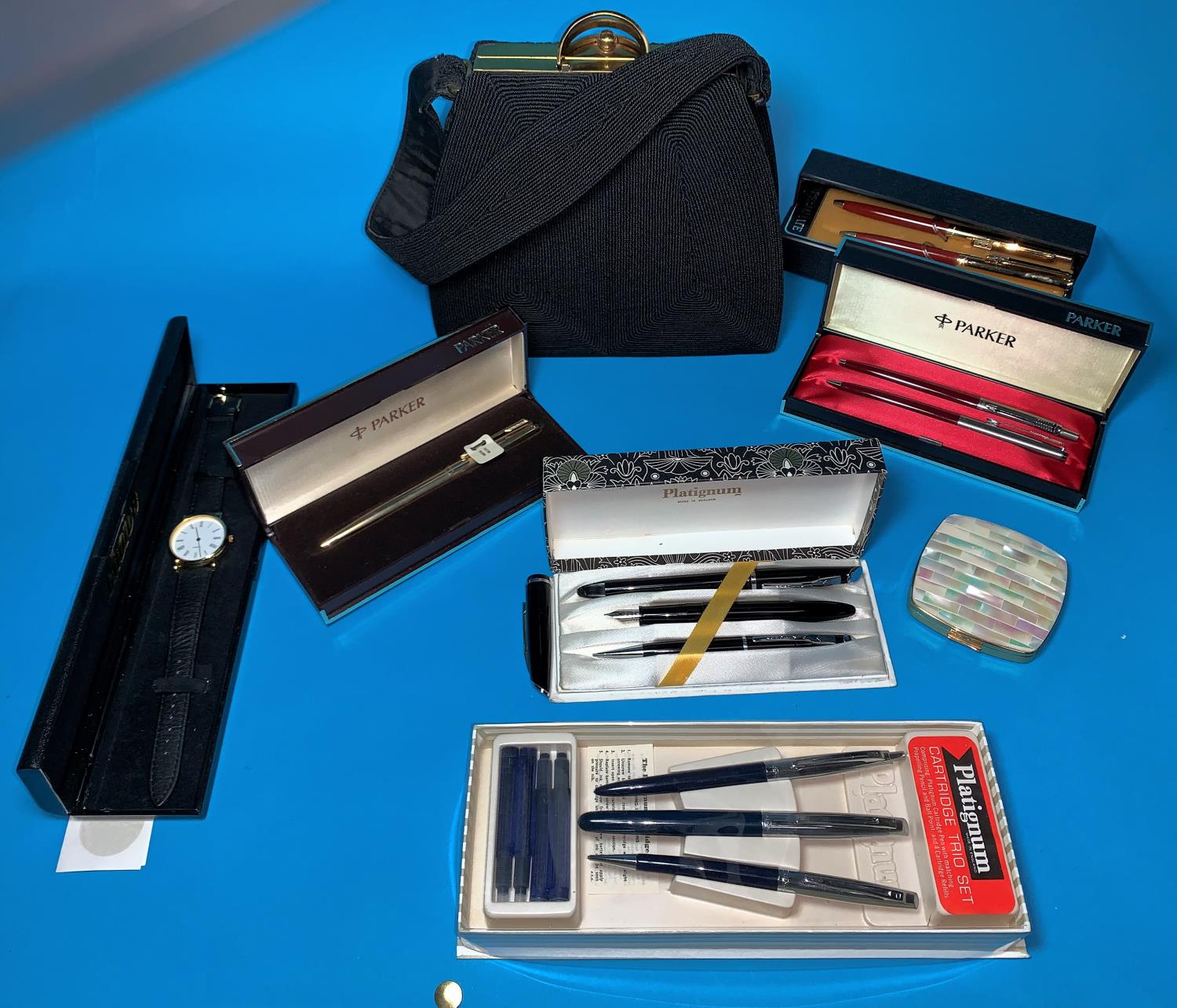 A Parker gold plated ballpoint pen, cased; other pen sets; a 1950's handbag; a mother-of-pearl