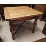 A refinished golden oak draw leaf dining table on bulbous legs